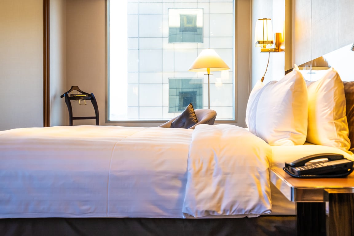 Cozy hotel room inviting guests to upgrade their stay.