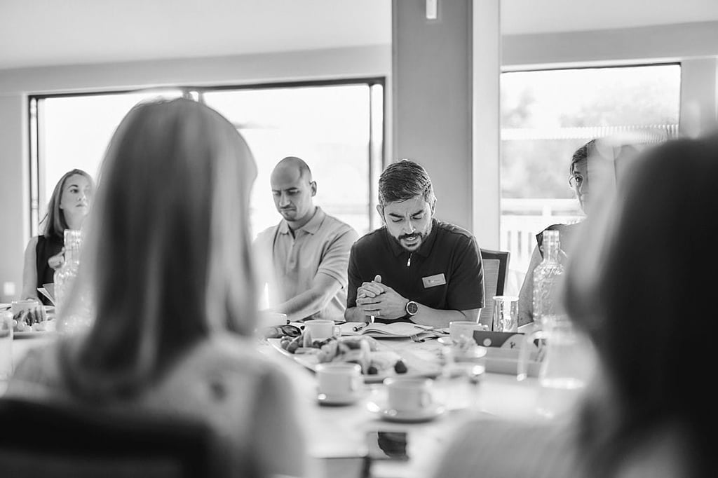 Joe D'Souza working with business owners
