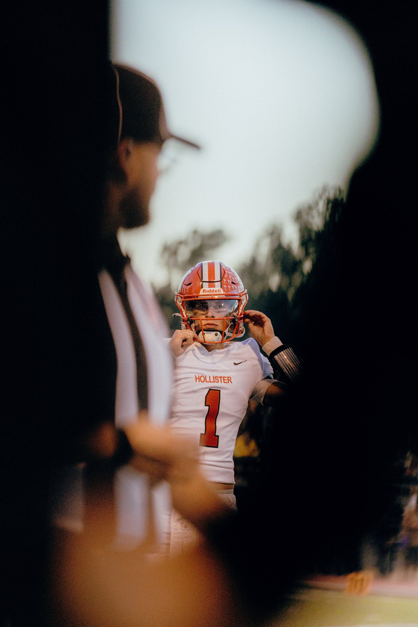 Football quarterback strapping up