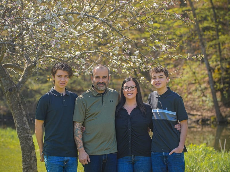 The family-owned Andrew's Pro Clean team outdoors under a blossoming tree in southern Minnesota