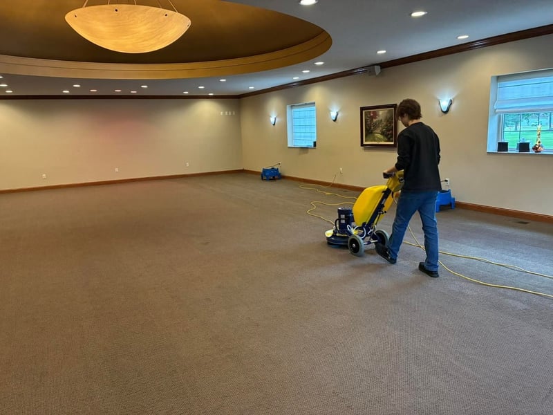 Very-low-moisture rotary carpet cleaning underway in a commercial event room by Andrew's Pro Clean, Owatonna, MN