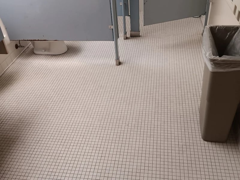 Commercial restroom tile and grout cleaned and restored by Andrew's Pro Clean in Owatonna, MN