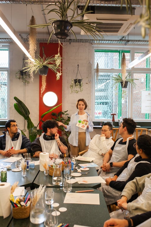 Creative workshop moment with art materials on the table.