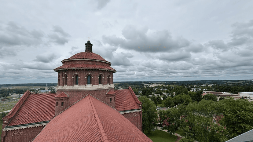 Red tile roof and dome of the Monastery Immaculate Conception above Ferdinand