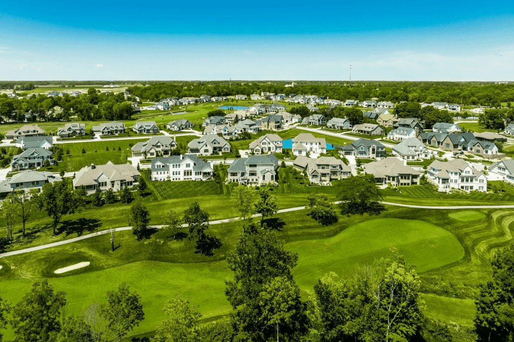 Aerial view of a Westfield, Indiana neighborhood of new homes bordering a green golf course