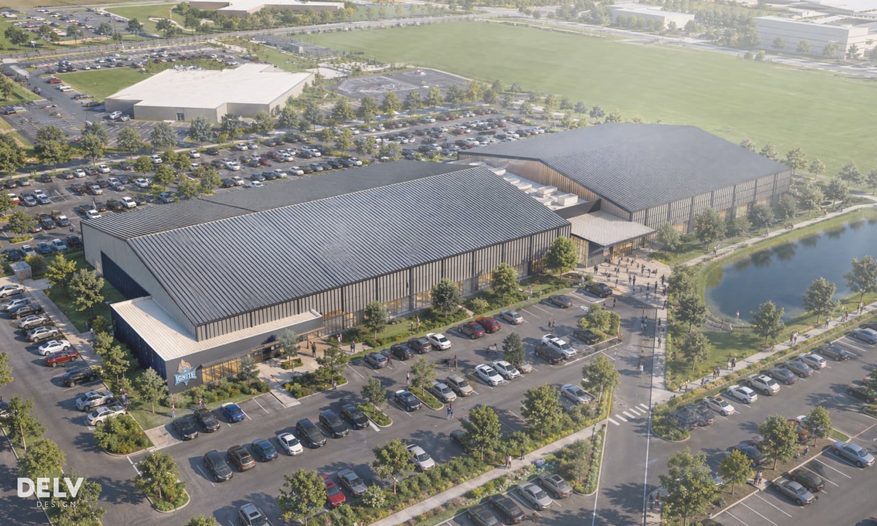 Aerial rendering of the 180,000-square-foot Fishers Fieldhouse complex next to Fishers Event Center, surrounded by parking, green space, and a pond
