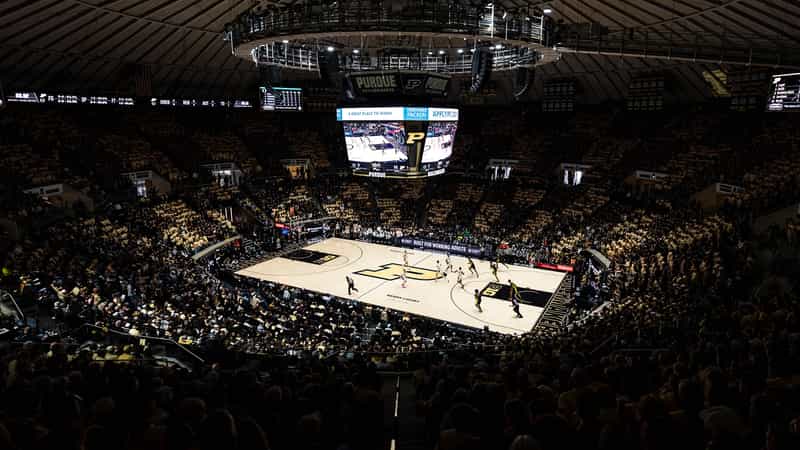 Packed Mackey Arena crowd watches Purdue play on Keady Court under the center-hung Purdue Boilermakers scoreboard