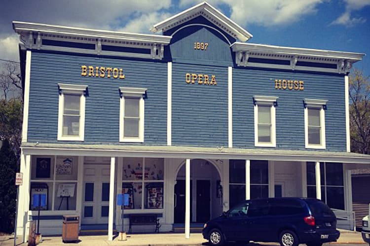 Blue two-story Bristol Opera House, marked 1897 on its peak, home of the Elkhart Civic Theatre in Bristol, Indiana