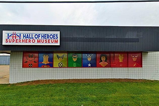 Hall of Heroes Superhero Museum building in Elkhart, Indiana, with window art of Superman, Wonder Woman, Captain America and other heroes