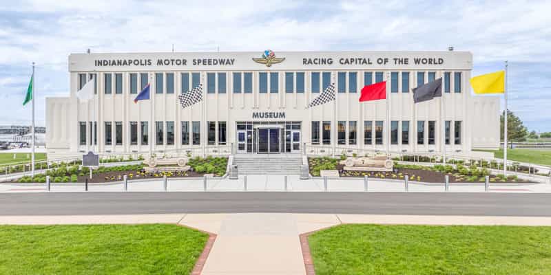 Indianapolis Motor Speedway Museum entrance with race flags out front