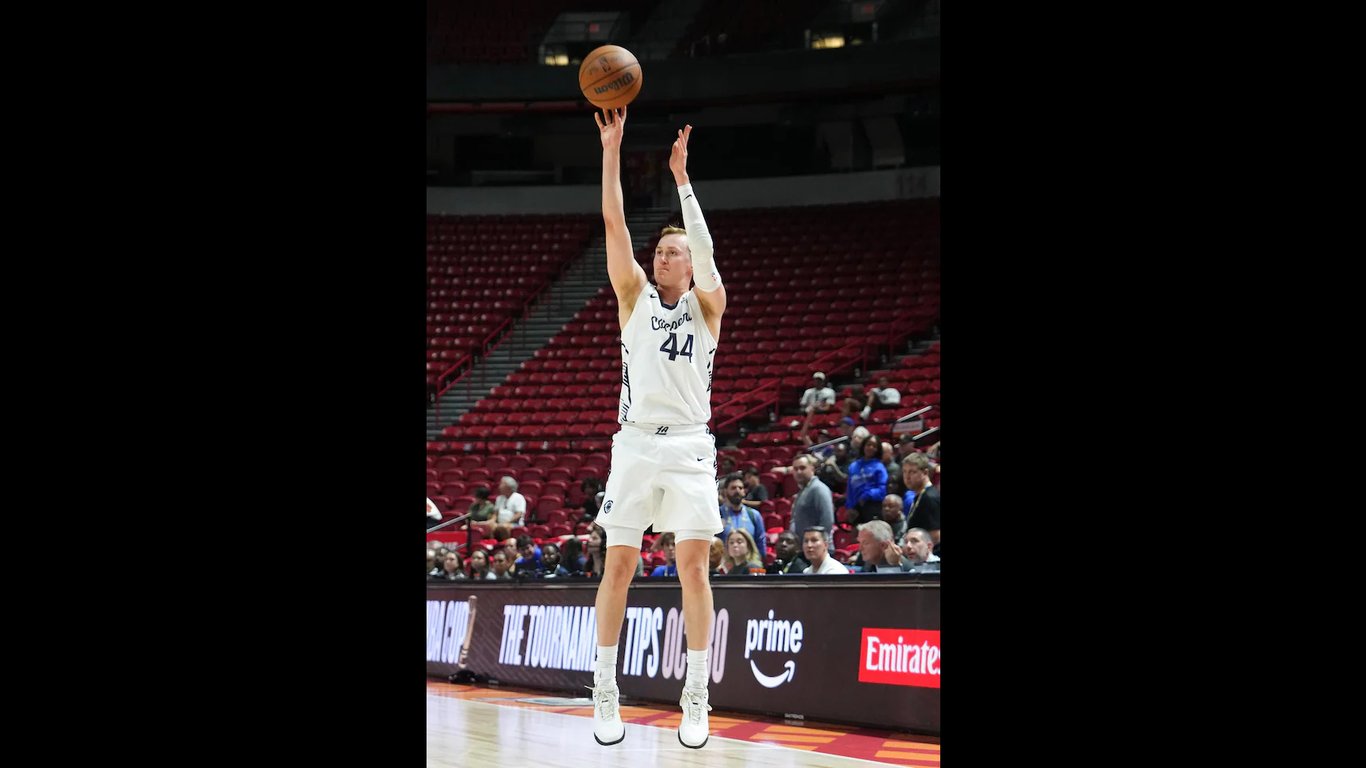 Purdue product Fletcher Loyer rises for a jump shot in a white Los Angeles Clippers Summer League uniform, number 44, in a Las Vegas arena.