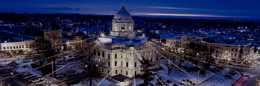 Monroe County Courthouse in Bloomington lit at night after a snowfall