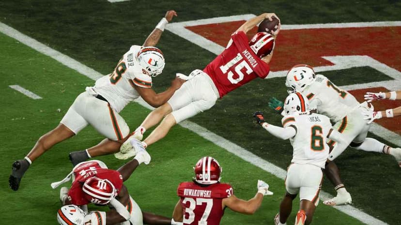 Indiana quarterback Fernando Mendoza diving toward the end zone against Miami in the national championship game