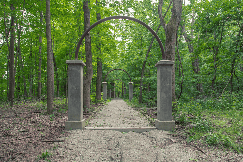Concrete pillars and metal arches along the old Rose Island path in Charlestown State Park