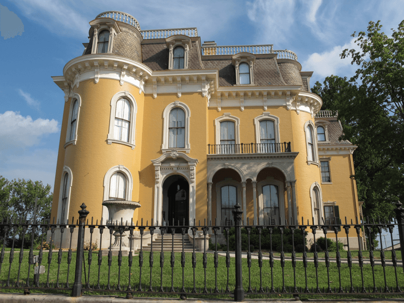 Yellow Victorian exterior of the Culbertson Mansion in New Albany