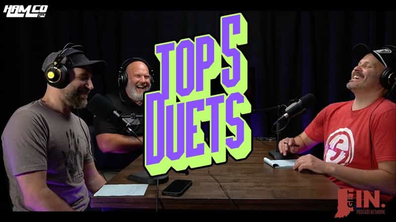Three hosts of the HamCo Live Hot Ticket podcast laugh at the studio table with microphones and headphones under a Top 5 Duets graphic