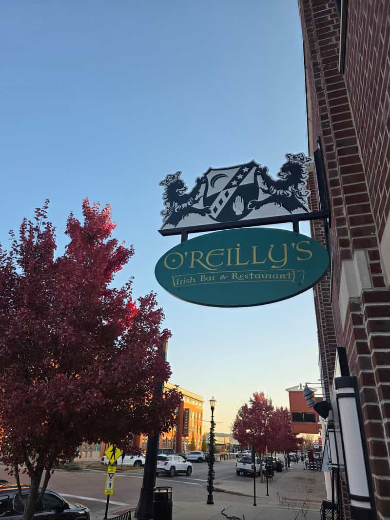 Hanging O’Reilly’s Irish Bar and Restaurant sign on the brick building in Speedway
