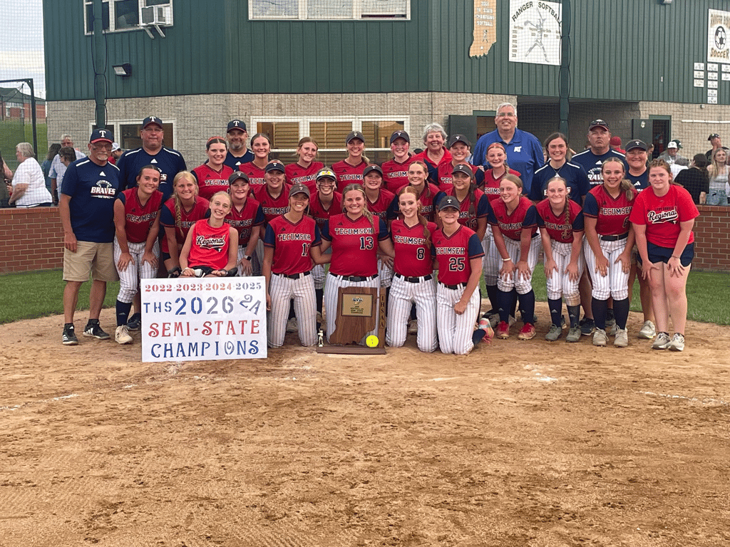 The Tecumseh Braves softball team poses with its semi-state trophy and a 2026 semi-state champions sign.