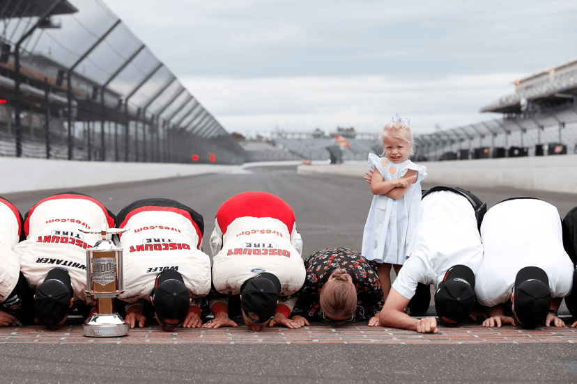 Drivers and crews kissing the bricks at the Indianapolis Motor Speedway start/finish line