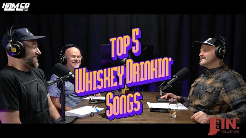HamCo Live hosts and guest Kurt Meyer laugh around a podcast studio table under a Top 5 Whiskey Drinkin' Songs title