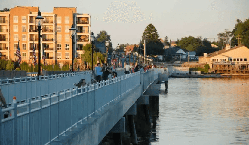 Walkers on a waterfront walkway along Morse Reservoir in Cicero