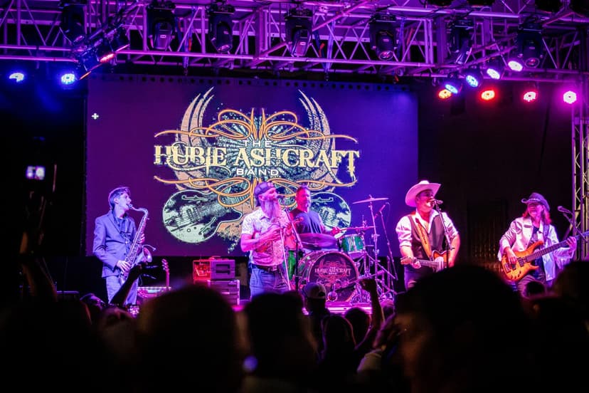 The Hubie Ashcraft Band performs under purple stage lights at the 2026 Cruise-In Concert in Auburn, Indiana