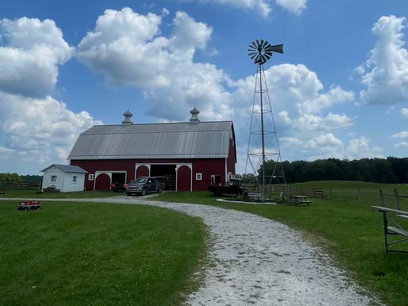Red barn and windmill at The Farm at Prophetstown State Park