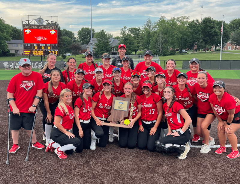 The New Palestine Dragons softball team poses with its semi-state championship trophy.