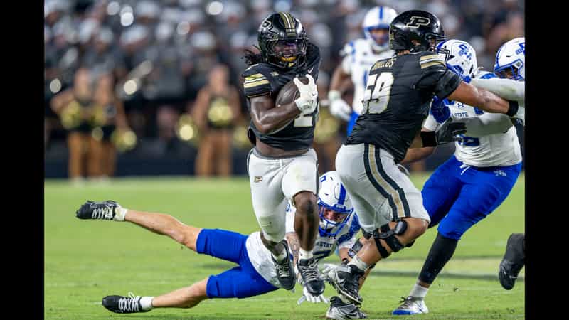 Purdue running back Fame Ijeboi carries the ball through Indiana State defenders at Ross-Ade Stadium