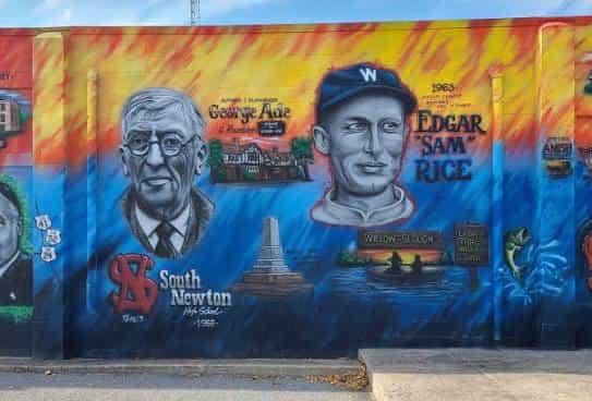 Colorful mural in Newton County, Indiana of writer George Ade and baseball player Edgar "Sam" Rice, painted alongside a South Newton High School logo and a canoe scene at Willow Slough