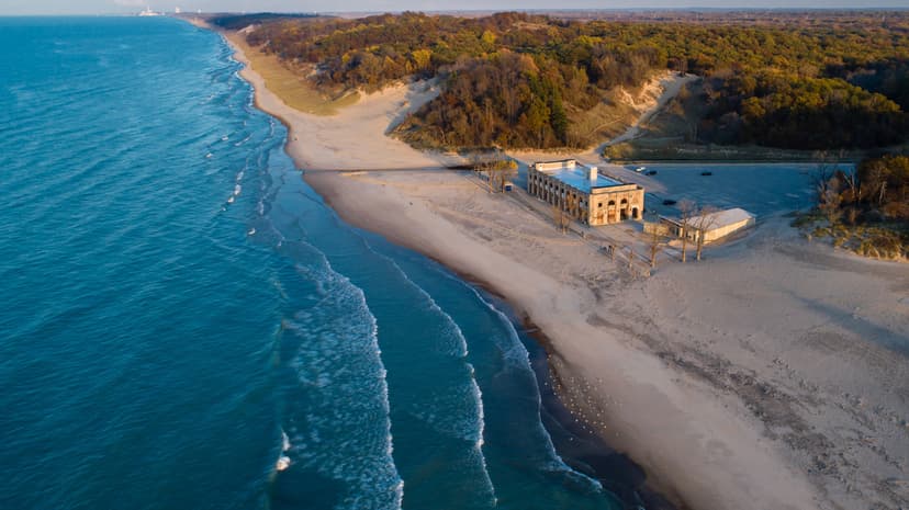 Aerial view of a Lake Michigan beach and a historic beach pavilion along the Indiana Dunes shoreline