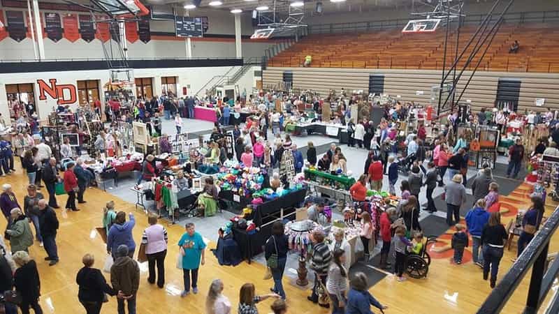 Overhead view of vendor booths filling the North Daviess gym during the community craft show