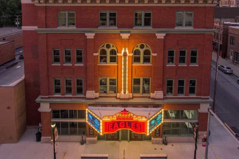 Eagles Theatre's lit marquee on its brick building in downtown Wabash