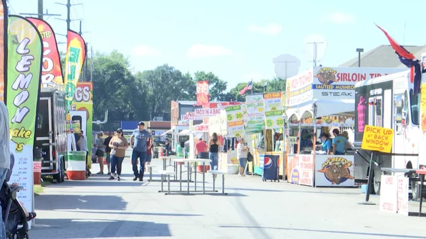 Food vendor booths line a sunny festival street in Central Indiana, from lemon shake-ups to sirloin tip sandwiches