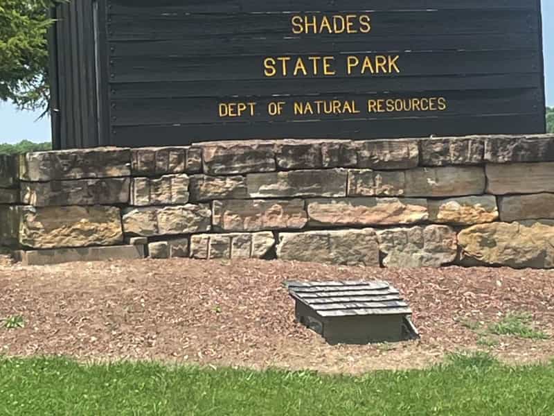 Shades State Park entrance sign on a stone base near Waveland
