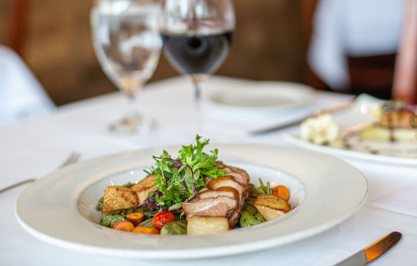 Dining room and plated course at LaSalle Grill in downtown South Bend
