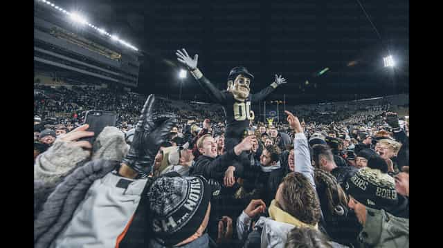 Purdue Pete hoisted above a night crowd of fans storming the field at Ross-Ade Stadium in West Lafayette after a Boilermakers upset