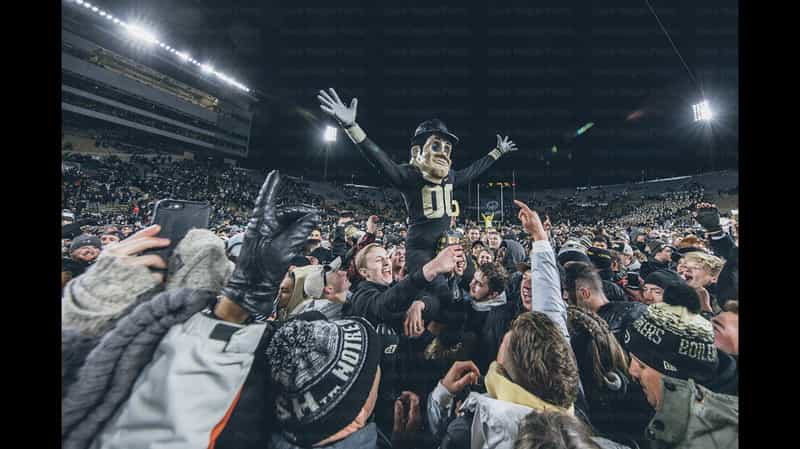 Purdue Pete hoisted above a night crowd of fans storming the field at Ross-Ade Stadium in West Lafayette after a Boilermakers upset