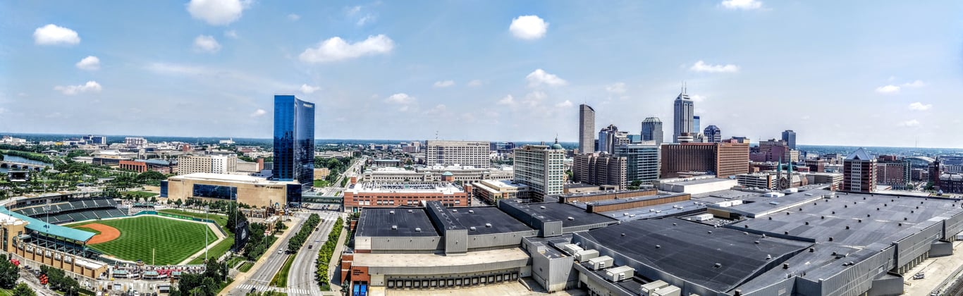 Panorama of downtown Indianapolis from the southwest, with Victory Field baseball stadium and the JW Marriott tower on the left and Convention Center roofs in the foreground