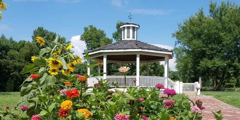 Octagon pavilion and summer flowers at Old Town Waverly Park near Martinsville