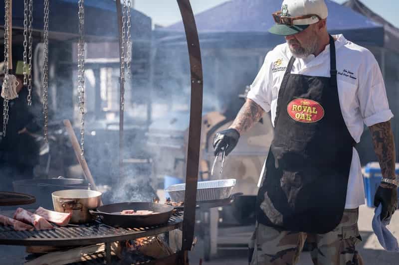 A competitor cooking over an open fire at the World Food Championships