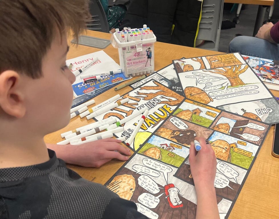 Henry hard at work on his comic