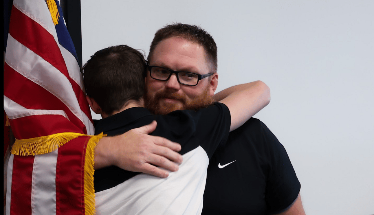 Jackson (left) hugging Adam (right) after the ceremony