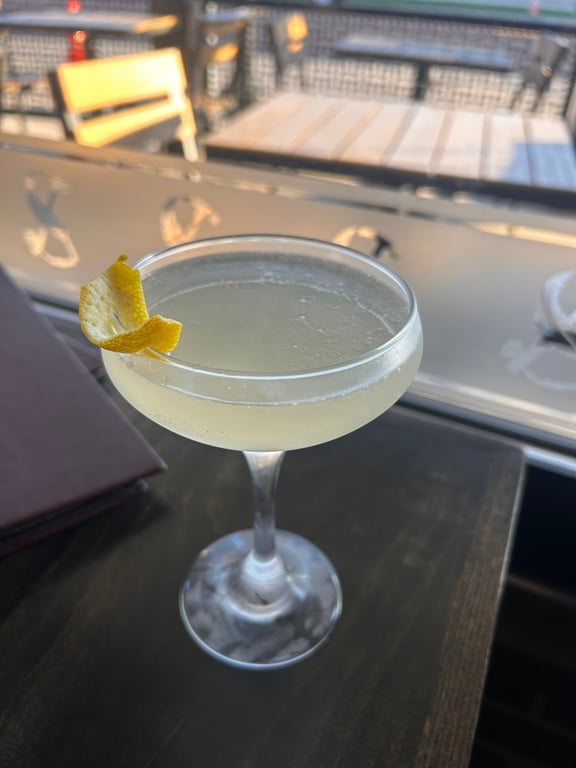 French 75 at a table near the window