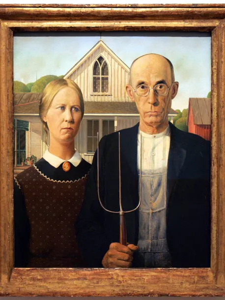 Grant Wood's painting American Gothic in a wooden frame: a stern farmer holding a pitchfork beside a woman, with a white house and a pointed Gothic window behind them.