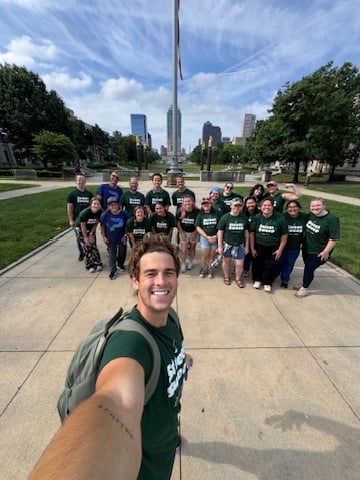 Group selfie with the whole crew after a downtown sweep