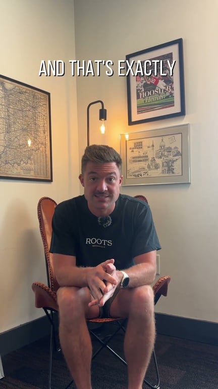 Roots partner in a chair, talking to camera: We Bought an Entire Building With $0