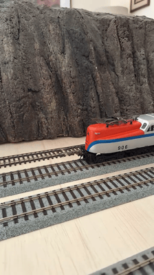 Seldom seen Penn Central Bicentennial Heritage unit with manifest freight.