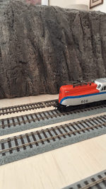 Seldom seen Penn Central Bicentennial Heritage unit with manifest freight.
