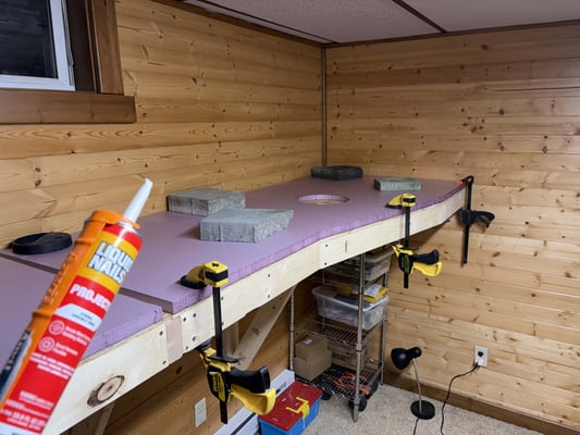 Gluing down the first foam panel, day 6 of benchwork construction